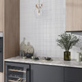 Cotton white textured ceramic rectangular wall tile 18x48 applied as kitchen backsplash