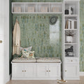 Moss green glossy ceramic picket tile, elongated hexagon shape, used on indoor wall surface