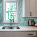 Sky blue glossy glass penny round mosaic tile installed as kitchen backsplash