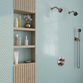 Glossy icy blue glass penny round mosaic tile wall in bathroom shower area