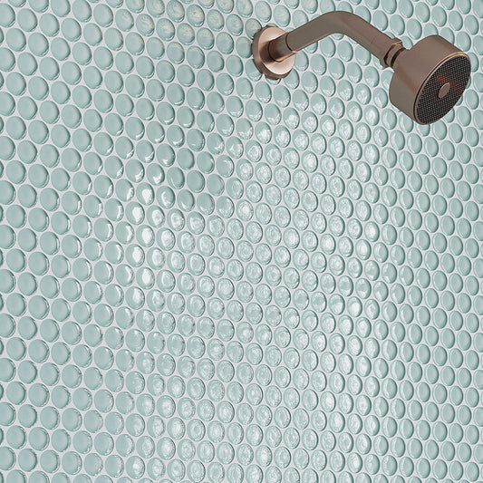 Glossy light blue glass penny round mosaic tiles on shower wall