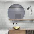 white glossy penny round glass mosaic tile wall in bathroom with round mirror