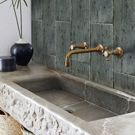 Dark gray 8x24 matte porcelain tiles installed on a bathroom wall