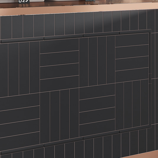Black matte ceramic 2x8 subway tile arranged on a wall surface with varied vertical and horizontal patterns