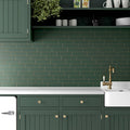 Green matte ceramic 2x8 subway tile backsplash in kitchen wall application