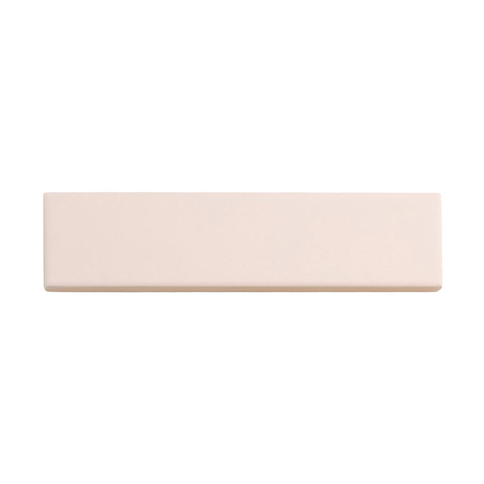 Matte ceramic subway tile in a soft pink tone and horizontal stack pattern