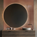 Glossy red ceramic pencil tile trim installed vertically on bathroom wall