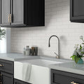 white matte ceramic subway tile 1.97x7.87 inches installed on kitchen backsplash 