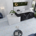 Light blue natural porcelain square floor tile 24x24 inches with subtle gold accents in a glossy finish