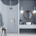 Light blue 12x12 natural uniform square porcelain mosaic tile with natural finish on curved shower wall and bathroom vanity