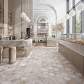 Light brown matte hexagon porcelain tile floor in bakery interior, 10x10 inches