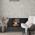 Soft white and beige honed marble hexagon mosaic tile on wall with 2x2 inch chips
