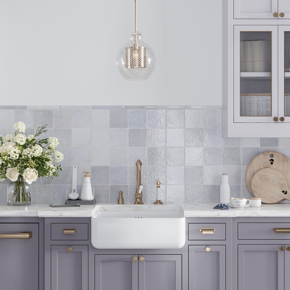 Purple 5x5 Glossy Subway Ceramic Tile in a pastel purple, white, and gold kitchen