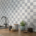 White and gray polished marble mosaic tile with 12x12 inch checkerboard pattern on kitchen wall