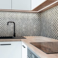 White gray polished Carrara marble penny round mosaic tile backsplash in kitchen wall