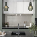 Light tea green ceramic bullnose tile trim with matte and glossy finish on kitchen backsplash