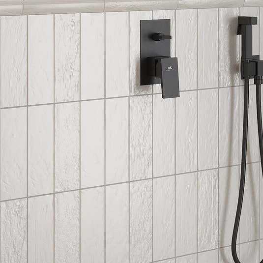 White honed ceramic subway tiles 2.5x8 inches on bathroom shower wall with matte finish