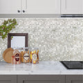 Polished white mother of pearl square mosaic tile backsplash in kitchen, 12x12 inch tiles