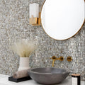 Polished square mother of pearl mosaic tile with iridescent finish on bathroom wall