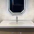 Beige and white polished shell mother of pearl mosaic tile in basketweave pattern on bathroom wall
