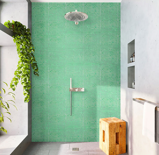 Glossy green glass mosaic square tiles 12x12 inches installed on shower wall