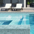 Glossy blue-gray glass mosaic tiles, 12x12, installed on swimming pool floor and surrounding ledge