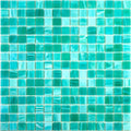 Glossy cyan blue 12x12 glass mosaic tile sheet with varying turquoise and bright blue square tiles