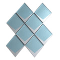 blue metallic silver glass mosaic diamond shaped wall tiles arranged in a pattern