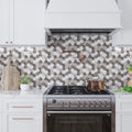 Polished gray and white marble floral mosaic tile backsplash in kitchen