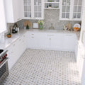 Polished beige and white hexagon Bianco Carrara marble mosaic tile floor in kitchen