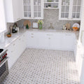 bright white kitchen with hexagonal patterned grey mosaic floor tiles and herringbone gray marble backsplash
