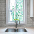 Polished gray beige Bianco Carrara Bardiglio marble mosaic tile with wavy pattern on kitchen backsplash