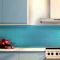 Sapphire blue glossy penny round glass mosaic tile backsplash in kitchen setting