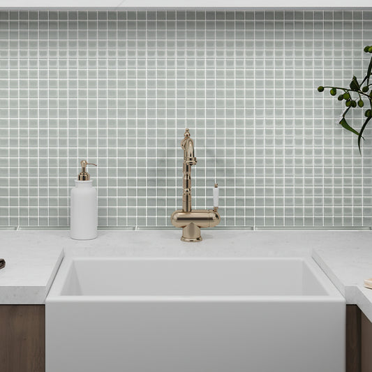 12x12 gray matte uniform square glass mosaic tile backsplash installed in a bathroom