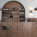 Copper 12x12 honed brick-shaped PVC peel and stick tile on bar backsplash wall