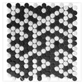 Tumbled black and white marble mosaic tile with round chips in a geometric pattern
