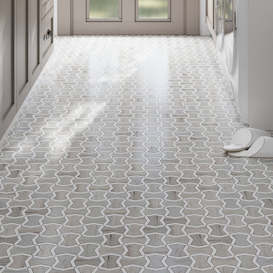 Warm beige Thassoss white 10x10 polished bowtie mosaic tile floor with crystal sand finish