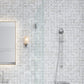 White gray polished octagon and dot calacatta gold Thassos mosaic tile wall with subtle marble veining