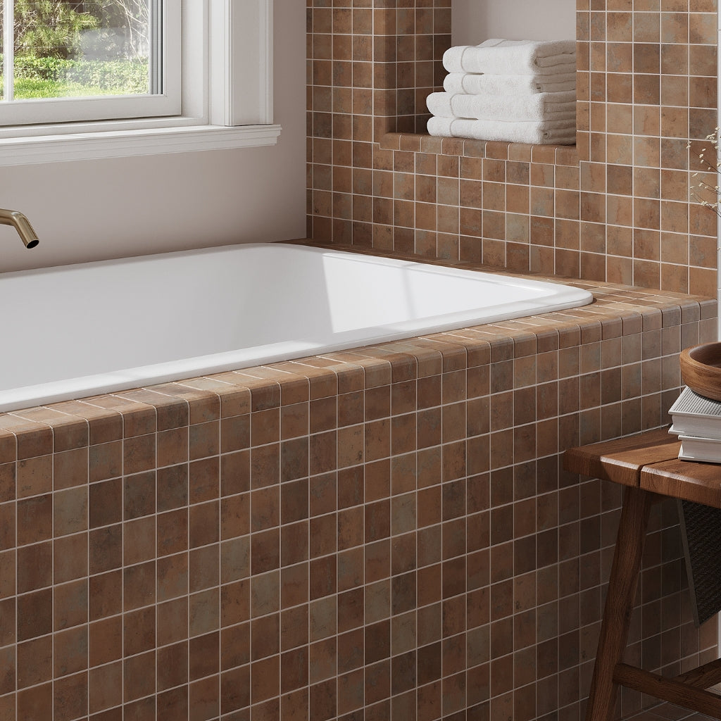 taupe matte recycled glass square mosaic tiles installed around bathtub wall and ledge