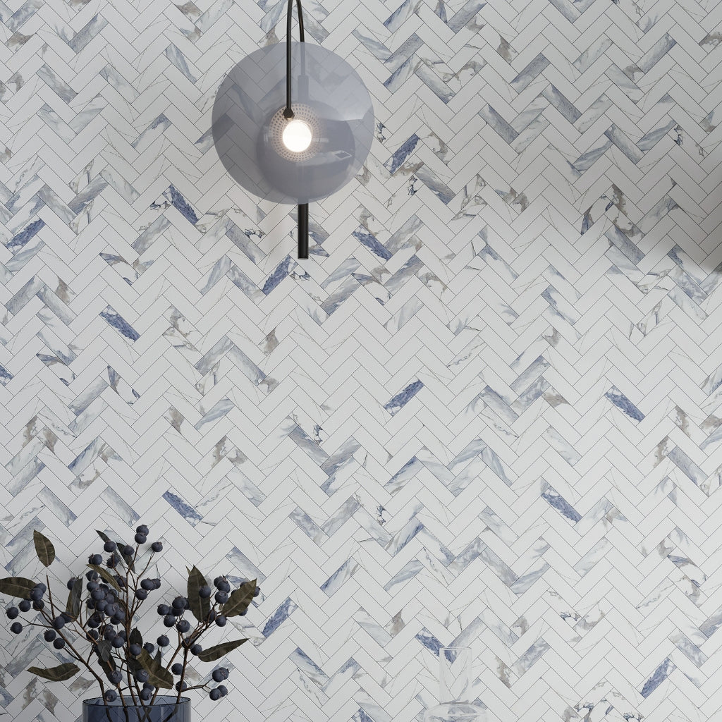 White and blue-gray polished porcelain tiles arranged in 11x12 herringbone mosaic pattern