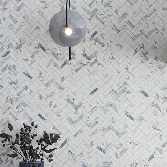 White and blue-gray polished porcelain tiles arranged in 11x12 herringbone mosaic pattern