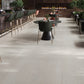 beige matte porcelain large tile flooring with subtle texture in spacious modern indoor setting