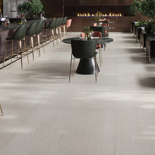 beige matte porcelain large tile flooring with subtle texture in spacious modern indoor setting