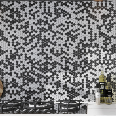 black and white tumbled penny round marble mosaic tile backsplash in kitchen setting