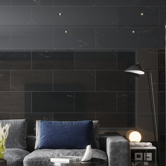 sleek polished eastern black 12x24 marble tiles with subtle veining in large rectangle format