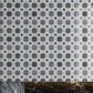 polished floral marble mosaic tile in carrara, eastern grey, and thassos marble with geometric pattern
