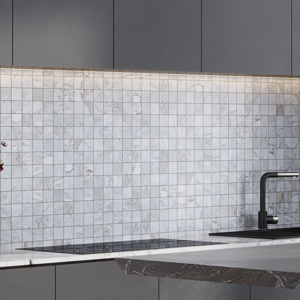 Pale gray 12x12 polished porcelain mosaic tile backsplash with subtle beige veins and polished finish