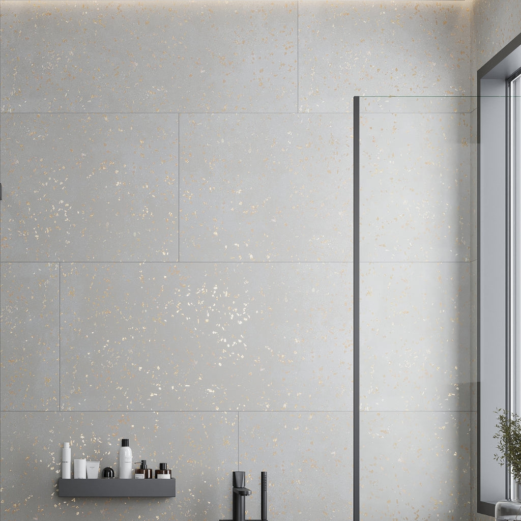 Warm gray porcelain large format tile with gold flecks and matte finish, 24x48 inch rectangular shape