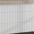 Glossy white 2x8 ceramic subway tiles in a vertical stacked pattern with subtle shadowing