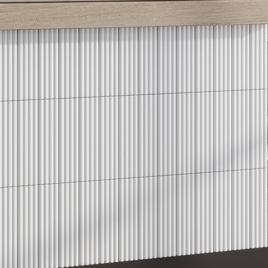 Glossy white 2x8 ceramic subway tiles in a vertical stacked pattern with subtle shadowing